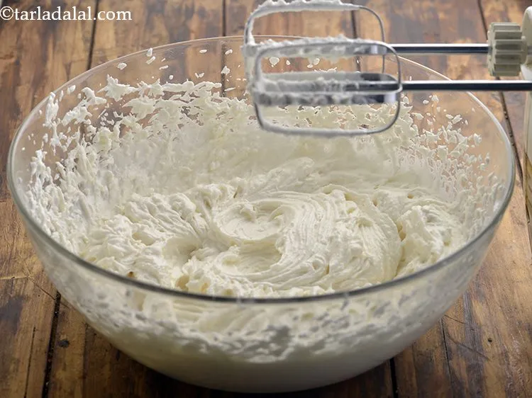 Step 8 – Combine the ghee and powdered sugar. Whisk well for 10 to 12 minutes or till …