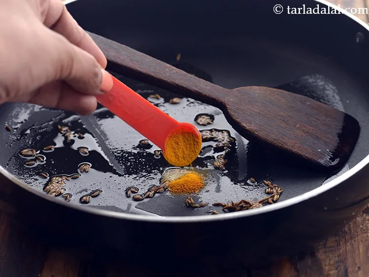 Step 5 – Add turmeric powder.