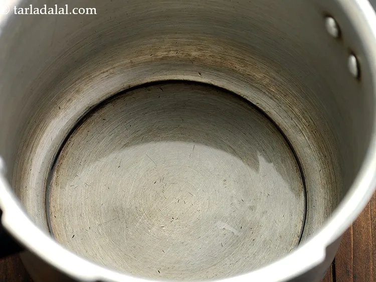 Step 3 – For preparing the bhopla soup, heat the oil in a pressure cooker. We have made …