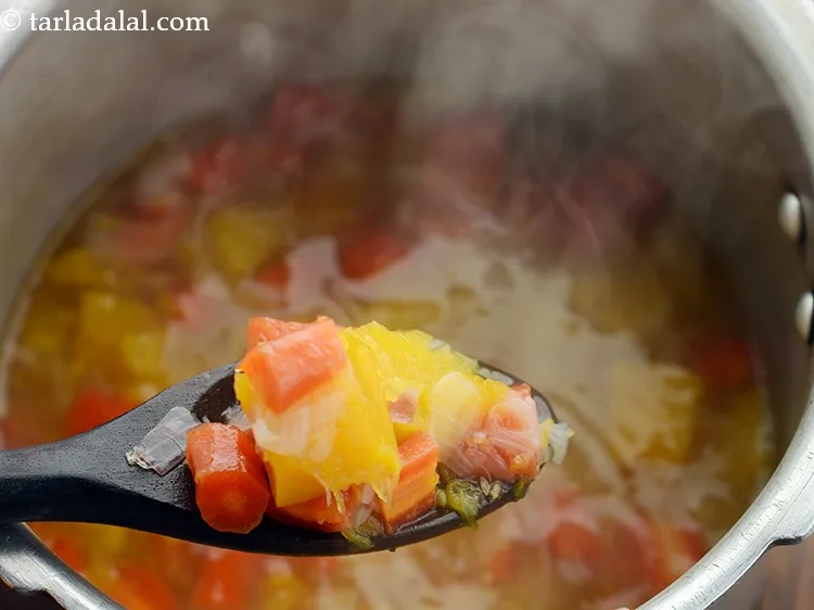 Step 12 – Pressure cook for 2 whistles. Allow the steam to escape before opening the lid. The …