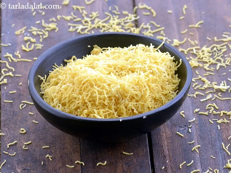 Step 48 – Divide the bhel into 2 equal portions and garnish each portion with 1 tbsp of …