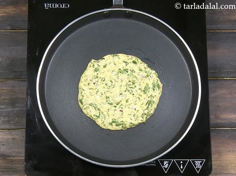 Step 34 – Spread it in a circular motion to make a 125 mm. (5&quot;) adai.