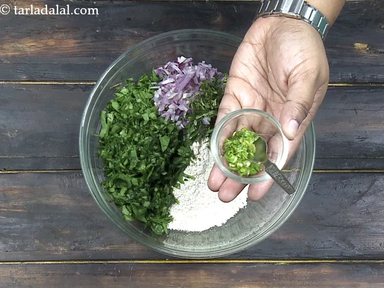 Step 20 – Add&nbsp;1 tsp&nbsp;finely&nbsp;<a href="https://www.tarladalal.com/glossary-chopped-green-chilli-820i">chopped green chillies</a>.