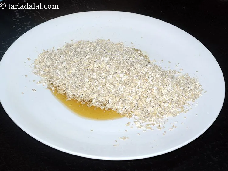 Step 19 – Add the roasted oats and sesame seeds to it.&nbsp;