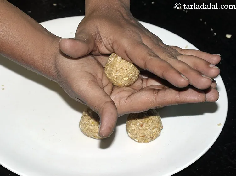 Step 26 – <div> Divide this mixture into 8 equal portions and roll each portion into a round …