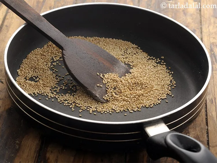 Step 13 – Dry roast sesame seeds (til) on a medium flame for 2 minutes.&nbsp;