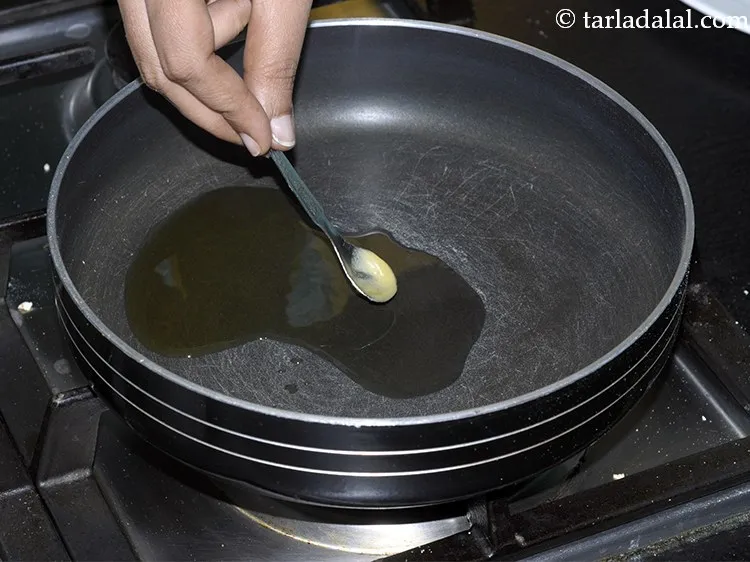 Step 15 – Next to make <strong>oats laddu</strong>, add <meta charset="UTF-8" />2 tsp&nbsp;<a href="glossary-ghee-245i">ghee</a> in the same broad …