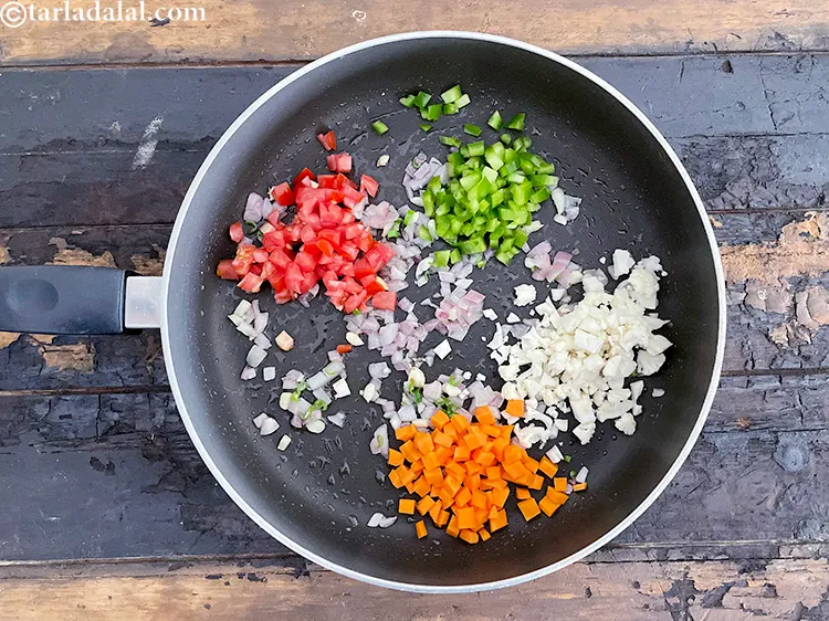 Step 19 – <html><head></head><body><p>Add&nbsp;2 tbsp&nbsp;finely&nbsp;<a href="glossary-chopped-carrot-798i">chopped carrots</a>.</p></body></html>