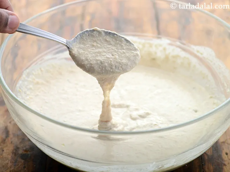 Step 11 – Mix well to make a batter of <strong>instant oats idli </strong>of pouring consistency.