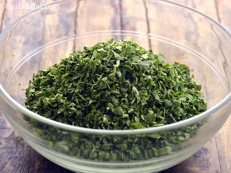 Step 4 – Add the fenugreek leaves. They have been washed and chopped before adding to the muthia …