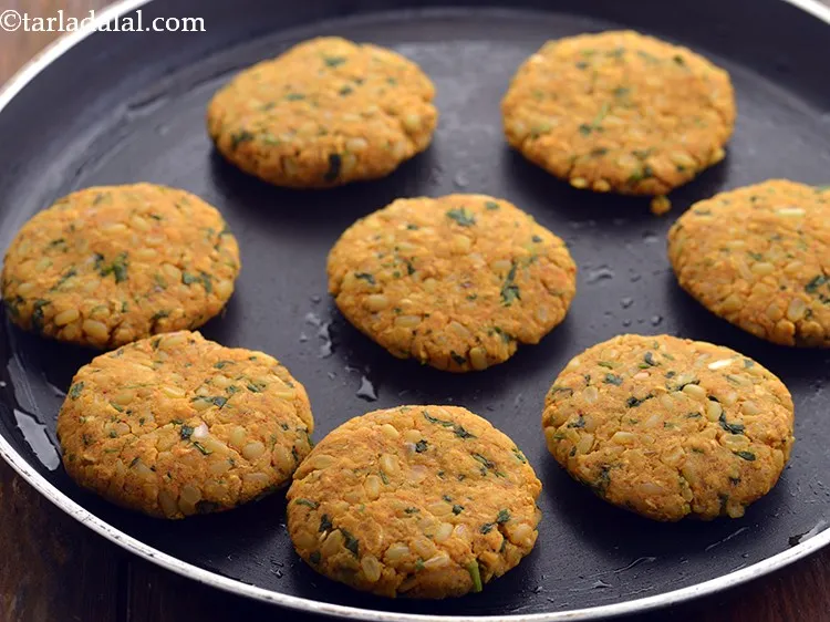 Step 22 – Place the tikkis carefully over it.