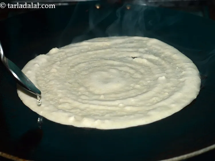 Step 28 – Smear &frac14; tsp of oil around the edges. Ghee/butter can also be used to make …