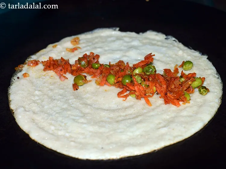 Step 30 – Place a portion of the stuffing in the centre of the dosa.