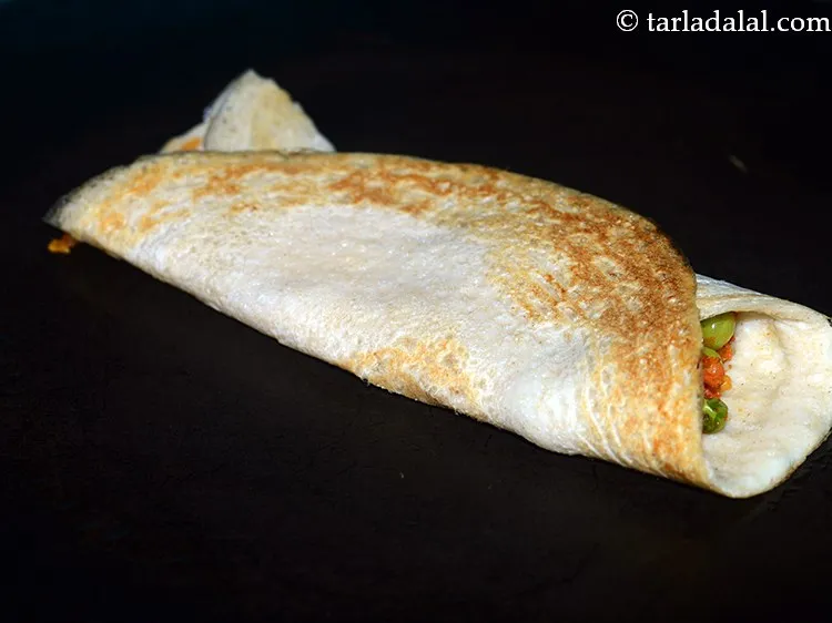 Step 31 – Fold oats pea dosa to make a roll or semi-circle. Remove the <strong>healthy oats matar …