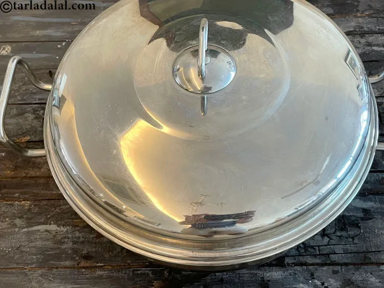 Step 24 – Steam in a steamer for 10 to 12 minutes or till the dhoklas are cooked.