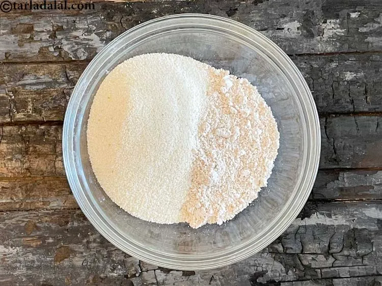 Step 6 – Add&nbsp;<meta charset="UTF-8" />1/2 cup&nbsp;<a href="glossary-semolina-sooji-rava-rawa-603i">semolina (rava / sooji)</a>.