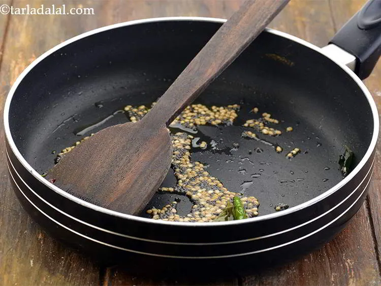 Step 12 – Saut&eacute; everything on a medium flame for 1 minute or till the dal turns light …