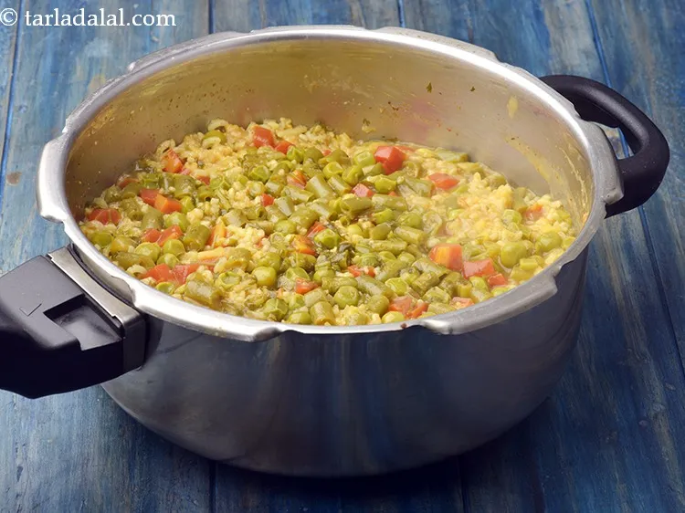 Step 27 – Mix well and pressure cook for 7 whistles. This recipe makes use of brown rice, …