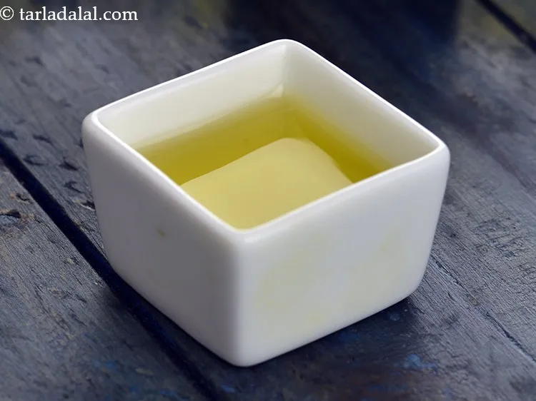 Step 46 – Olive oil for drizzling on the baked cheese burst pizza is suggested as an authentic …