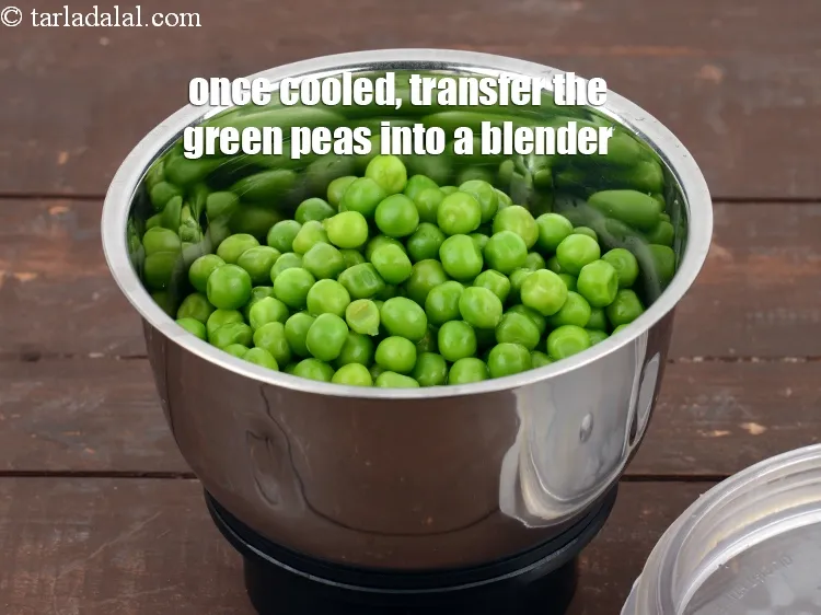 Step 13 – Once cooled, transfer the green peas into a blender.