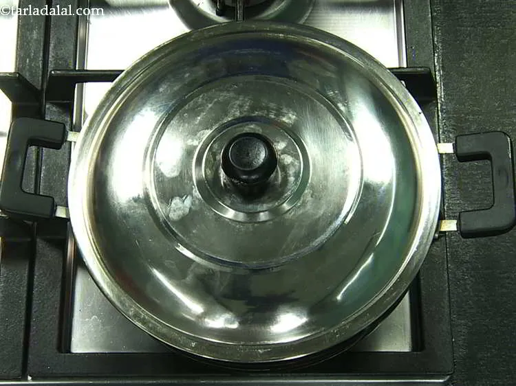 Step 11 – Mix well and cover and cook on a slow flame.