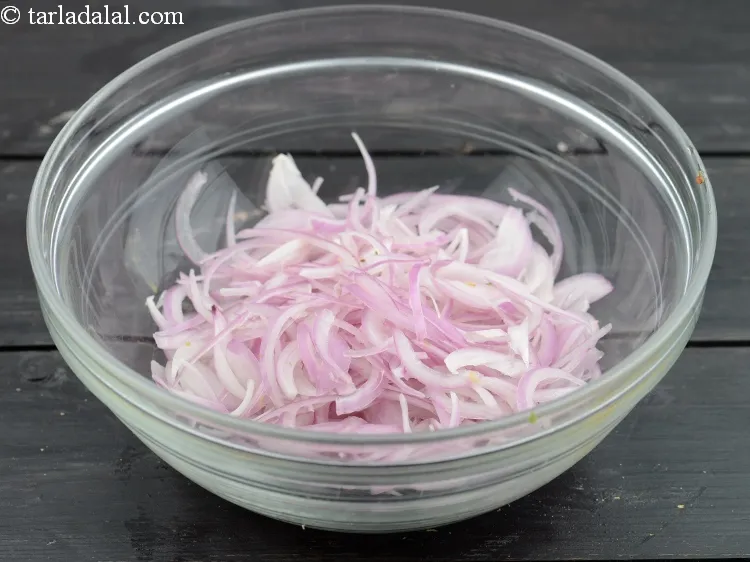 Step 3 – For the onion mixture, add 1 cup&nbsp;thinly&nbsp;<a href="https://www.tarladalal.com/glossary-sliced-onions-745i">sliced onions</a> in a deep bowl.&nbsp;