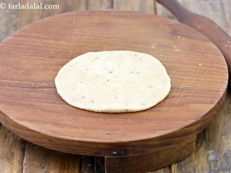 Step 20 – Place one portion of the dough on a rolling board and roll a portion of …
