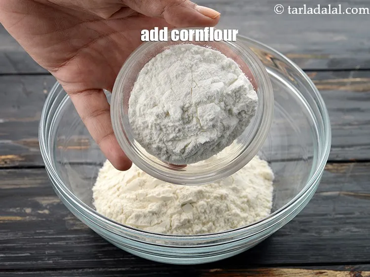 Step 4 – Add 1/4 cup&nbsp;<a href="https://www.tarladalal.com/glossary-cornflour-cornstarch-maize-starch-corn-flour-112i">cornflour</a>. The proportion of plain flour and cornflour should always be 2:1.
