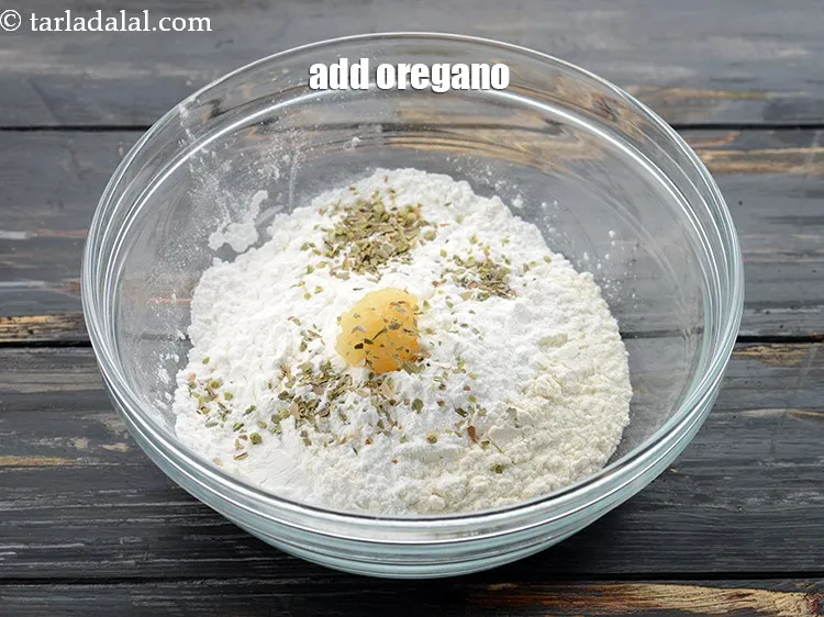 Step 6 – Add 1/4 tsp&nbsp;<a href="https://www.tarladalal.com/glossary-dried-oregano-268i">dried oregano</a>.&nbsp;