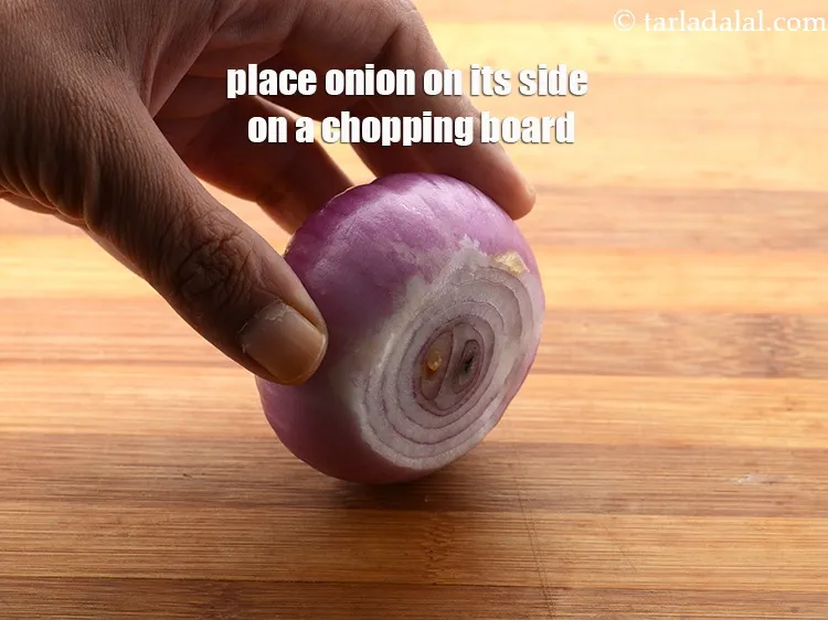 Step 15 – Place the onion on its side on a chopping board.&nbsp;