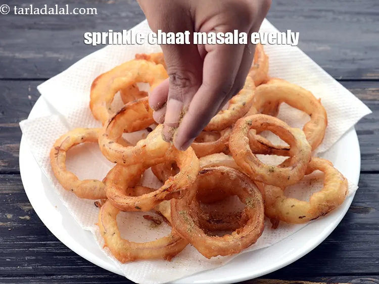 Step 30 – Sprinkle the chaat masala as you keep frying in each batch, so it coats the …