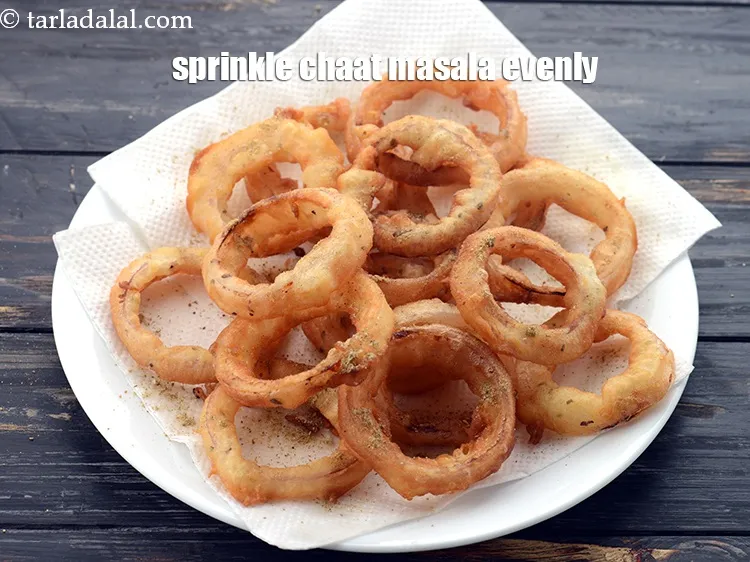 Step 26 – Toss <strong>onion rings recipe | Indian style onion rings | crispy fried onion rings | …