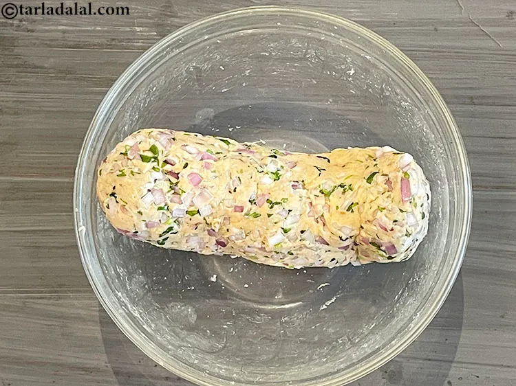 Step 13 – Make the dough into cylinderical shape. This makes it easier to make 6 equal pieces.&nbsp;