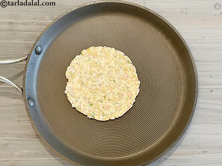 Step 17 – Flip over. This is what the roti looks like when cooked without oil.