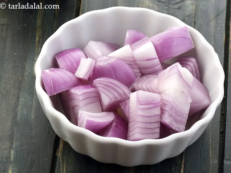 Step 22 – Add 1 cup&nbsp;<a href="https://www.tarladalal.com/glossary-onion-cubes-732i">onion cubes</a>.