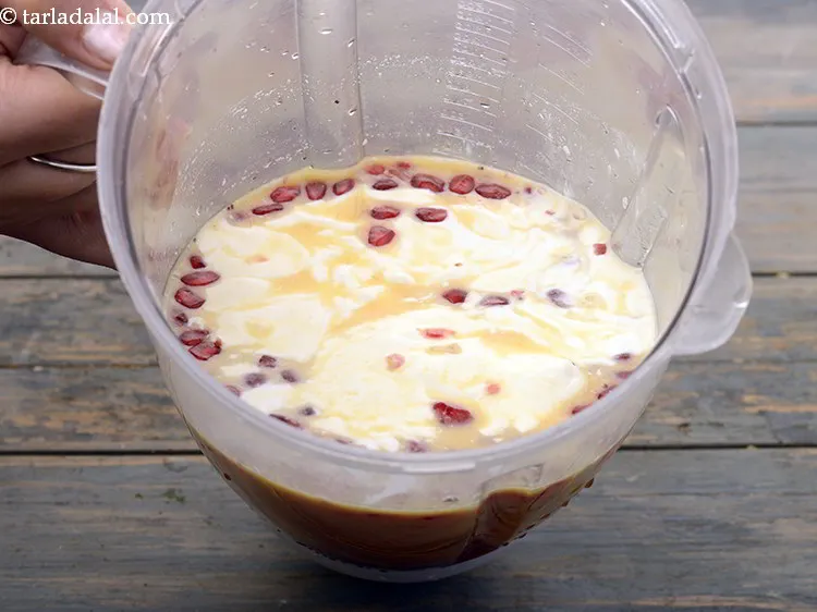 Step 6 – These are all the ingredients of <strong>orange pomegranate drink</strong> in the mixer jar.
