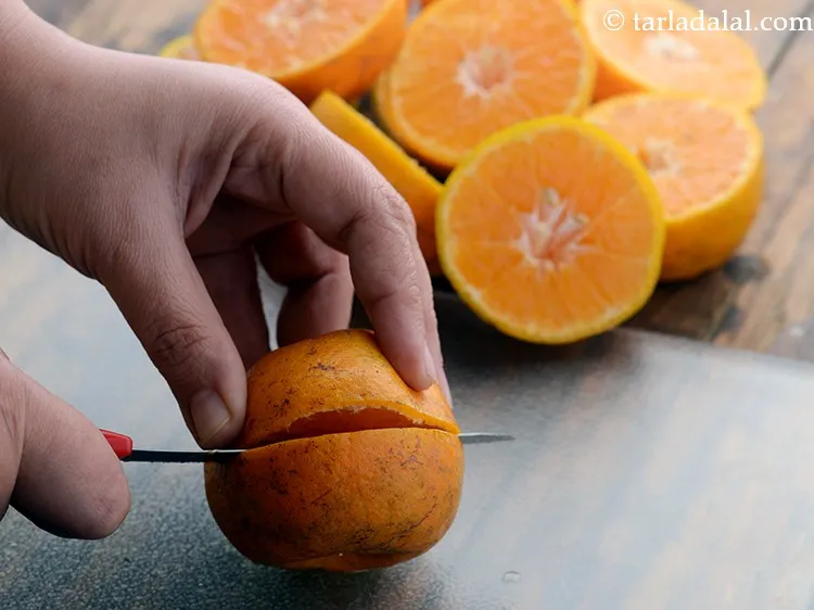 Step 13 – Cut each orange into 2 halves horizontally using a sharp knife.