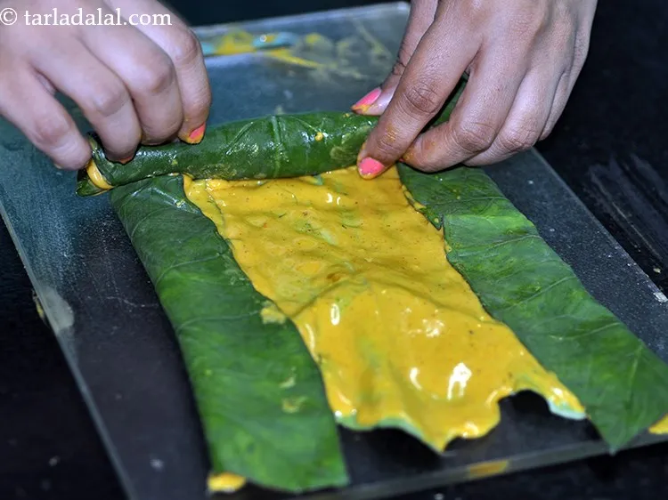 Step 22 – Roll it up tightly from one end to the other end while applying a little …