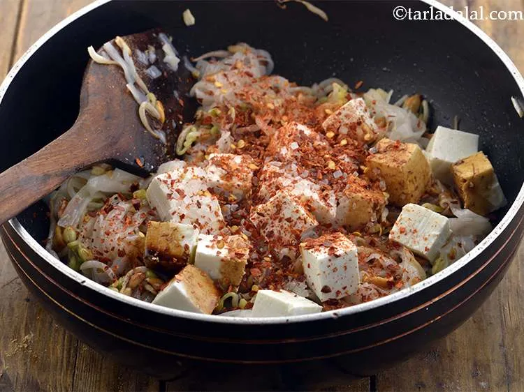 Step 18 – Add the chilli powder. You can use chilli flakes also if you wish to.&nbsp;