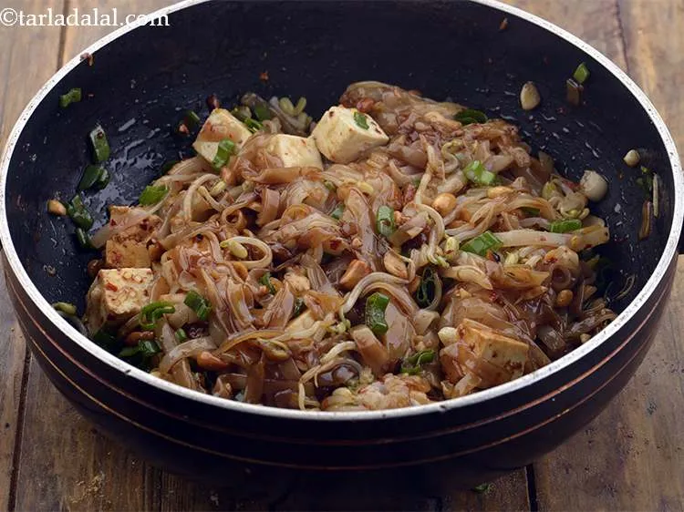 Step 22 – Give it a toss. Always use 2 flat spoons as it becomes easier to mix.