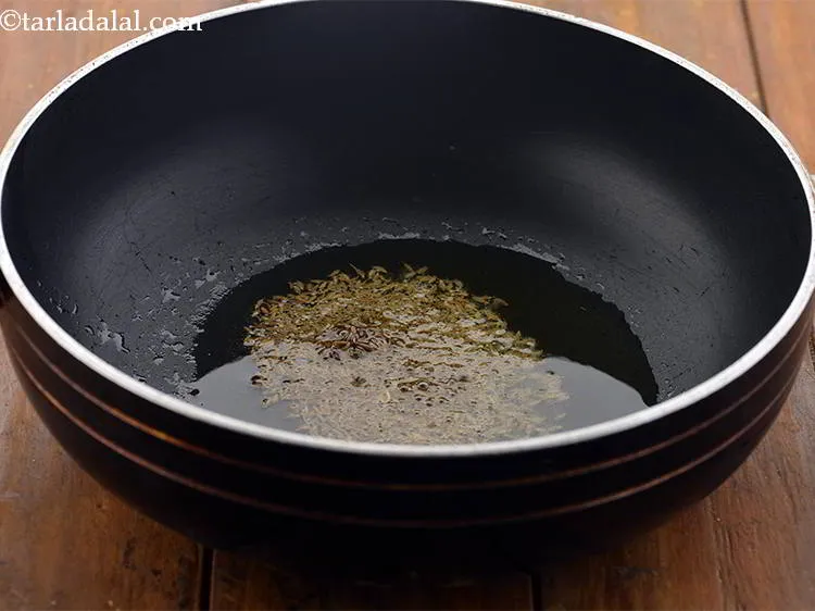 Step 16 – Once the ghee is hot, add the cumin seeds.
