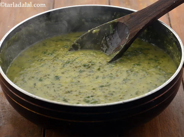 Step 22 – Mix well and cook &nbsp;the <strong>Palak Bajra Khichdi</strong> on a medium flame for 2 to …