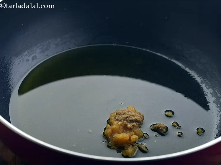 Step 18 – Once the ghee is hot, add the garlic and ginger paste.