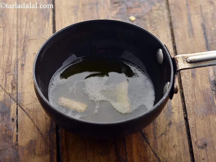 Step 31 – Once the ghee is nice hot, add the cinnamon.