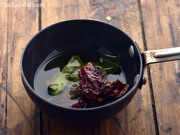 Step 36 – Add kashmiri dry red chilli and saut&eacute; on a medium flame for 1 minute.