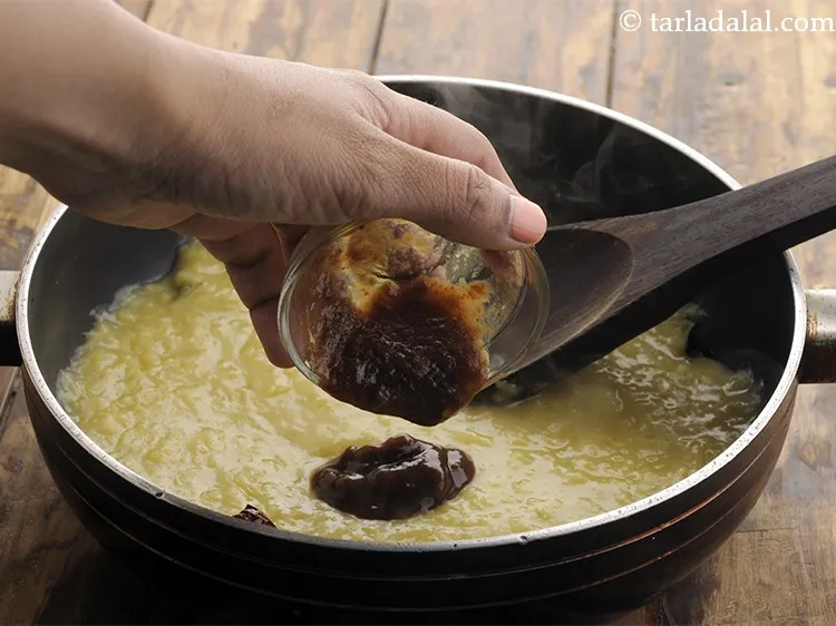 Step 18 – Add <a href="https://www.tarladalal.com/Tamarind-Pulp-Imli-Pulp-32648r" target="_blank">tamarind pulp</a>. This gives a pleasant sourness to our <strong>palak masoor dal</strong>. …