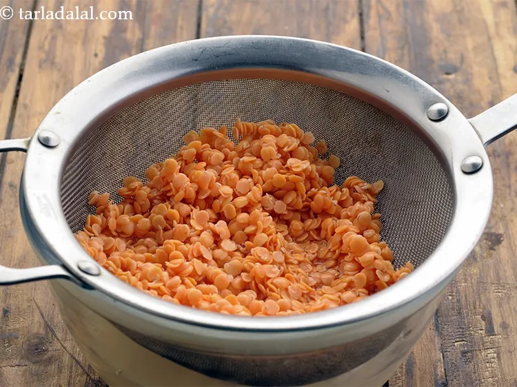 Step 5 – After an hour, drain the dal and discard the water.