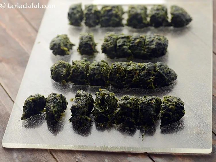 Step 24 – Cut the palak methi muthia rolls into 12 mm. (&frac12;&quot;) slices and keep aside.&nbsp; If …