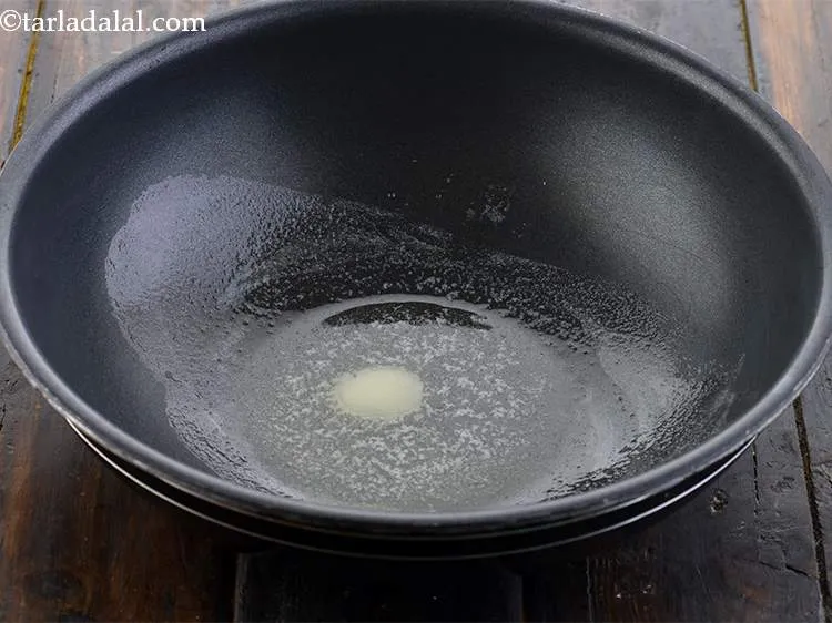 Step 17 – To make the&nbsp;<strong>Restaurant Style</strong>&nbsp;<strong>palak paneer gravy,</strong> take a kadhai and heat the oil and butter …