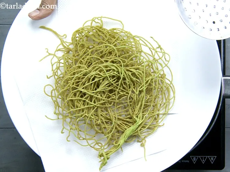 Step 30 – Carefully remove the sev with the help of a slotted spoon and drain on absorbent …